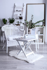 Interior of beautiful room with table and armchair