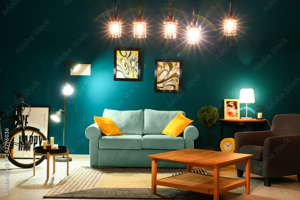 Wall mural Stylish interior of living room with comfortable sofa