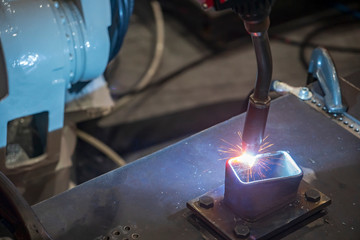 The operation of welding robot machine making part .Industrial 4.0 concept for modern manufacturing process.