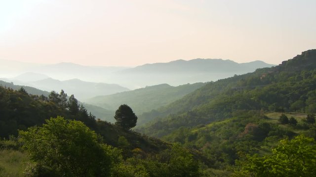 Pan: Rolling Green Hills With and a Small Town