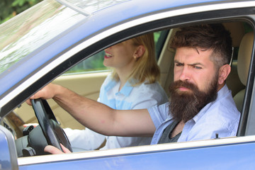 Ecology and environment. Bearded man and sexy woman driving car. Loving couple enjoy sustainable travel. Couple in love travel by automobile transport. Using sustainable transport for zero pollution