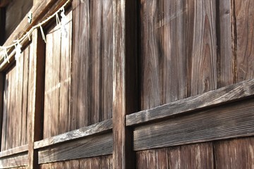 Shide hanged on Shimenawa around a shrine building which means sacred place in Japan