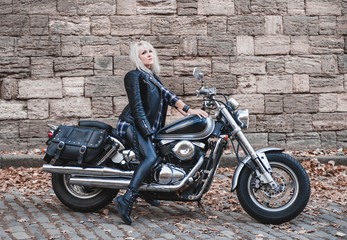 Plakat Beautiful biker woman outdoor with motorcycle. 