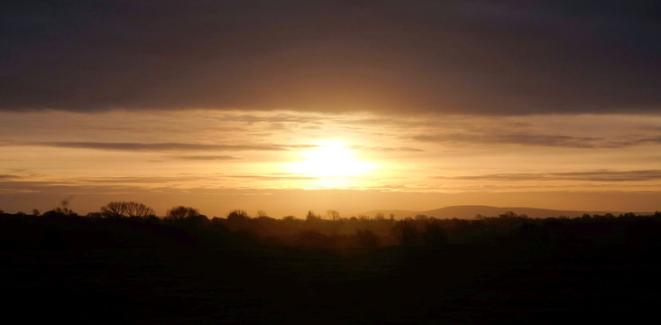 the sun rising over the Sussex countryside, Barcombe, Sussex, UK