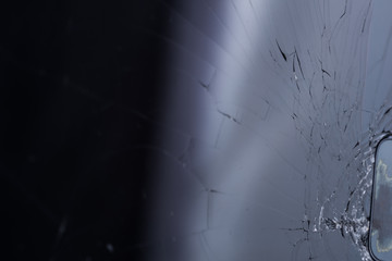 Broken smartphone screen, cracks and shattered glass under various eels
