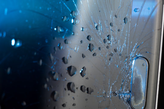 Broken smartphone screen, cracks and shattered glass under various eels