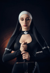 a nun with a weapon in the name of faith