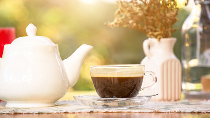 Fototapeta na wymiar hot cup of black coffee on table