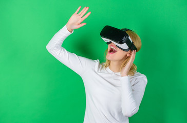 Woman using VR device. A person in virtual glasses flies in room space. Woman excited using 3d goggles. Augmented reality, technology, business and people concept -businessman in virtual glasses.