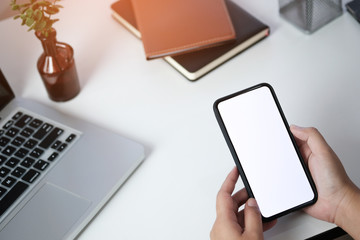 Close up of women's hands holding cell telephone blank copy space screen. smart phone with technology concept.