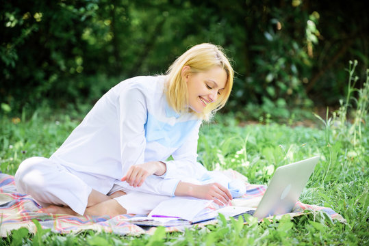 Online business ideas concept. Business picnic concept. Steps to start freelancing business. Business lady freelancer work outdoors. Woman with laptop or notebook sit on rug green grass meadow