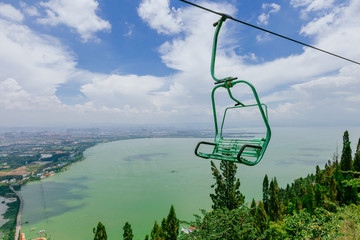 View of Dianchi Lake and cable chairlift traveling over Western Hills, in Kunming, China