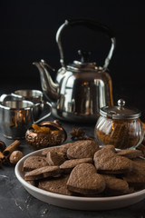 Vegan heart gingerbread cookies on dark background