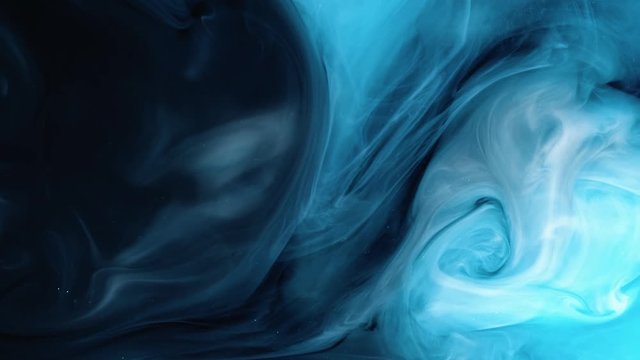 Universe Blue color paint pouring in water. Acrylic colors and ink in water. Abstract frame background. Colors and ink in water