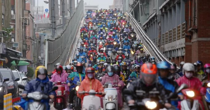 Crowded of scooter in taipei city at rain day
