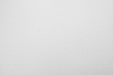 White textured wall background.