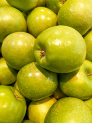 Ripe green apples as background