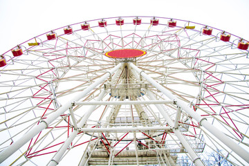 Ferris wheel in the snow in winter park.
