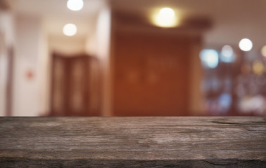 Empty dark wooden table in front of abstract blurred bokeh background of restaurant . can be used for display or montage your products.Mock up for space.