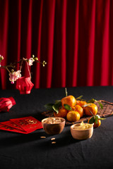 Lunar new year food and drink still life on black background. Translation of text appear in image:...
