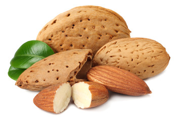 almond with green leaves isolated on white background