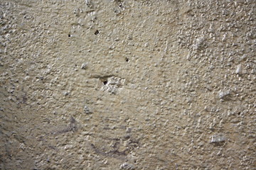 Vintage surface of old shabby wall with falling off plaster, beige-brown shades, background, texture