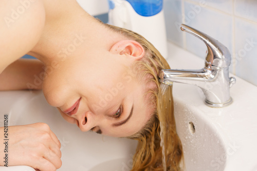 Woman Washing Hair In Bathroom Sink Stock Photo And Royalty