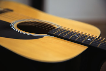 acoustic guitar in table