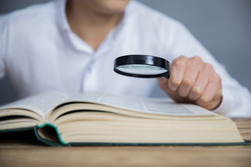 hand magnifier on book