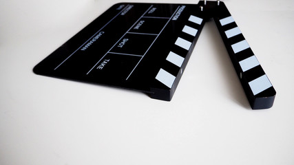 Clapperboard or clap board or movie slate use in video production ,film, cinema industry on black background.	