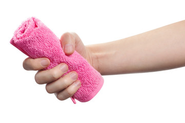 Hand holding pink towel, isolated on white background