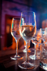 A glass of white wine in an isolated background.