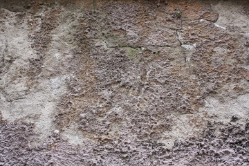 Wall finished with cement mortar, old and deteriorated