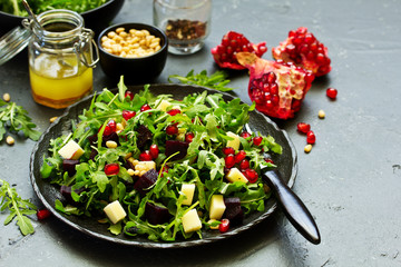 Fresh salad of arugula, beet and cheese.