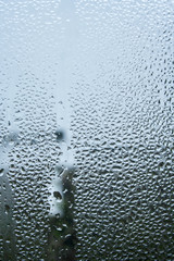 steamy glass. window covered with drops of water vapor