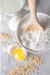 flour, eggs and oatmeal, milk top view.
