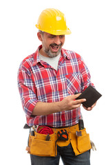 Builder making surprised expression as checking wallet.
