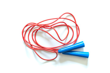 red and blue tied jumping rope isolated f