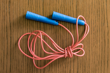 red and blue tied jumping rope isolated f