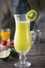 Fresh kiwi juice in a transparent glass