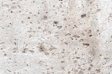 Old uneven whitewashed wall close-up