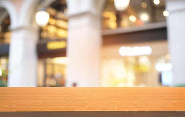 Empty dark wooden table in front of abstract blurred bokeh background of restaurant . can be used for display or montage your products.Mock up for space.