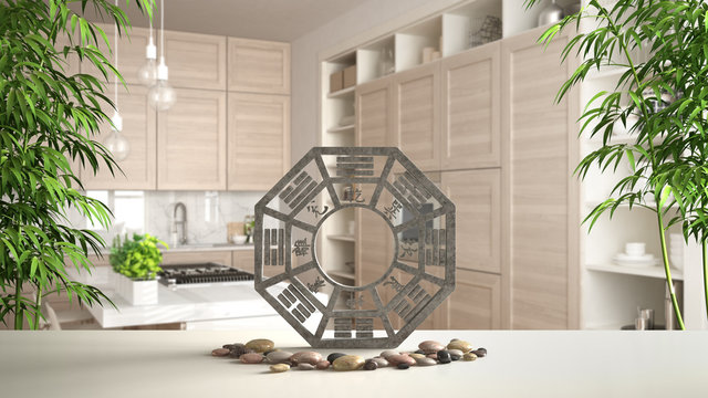 White table shelf with bagua, pebble stone and bamboo plants, modern white and wooden kitchen in contemporary apartment, zen concept interior design, feng shui template idea background