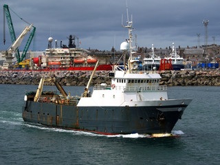 Trawler Leaving Port.