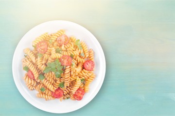 Delicious pasta on white plate on  background