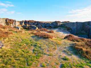 A long abandoned ancient gritstone quarry high on Curbar Edge in the Peak District.