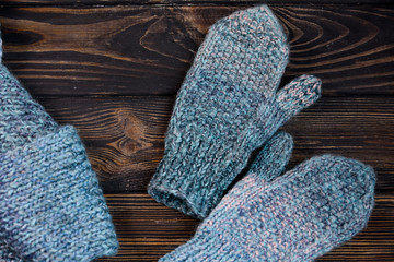 Fototapeta na wymiar Warm mittens in openwork pattern with a warm scarf.