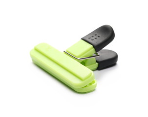 Green binder clip isolated on white background