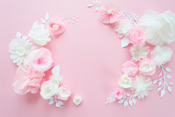 white and pink paper flowers on the pink background