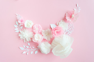 white and pink paper flowers on the pink background